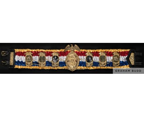 A unique replica of Muhammad Ali's first championship boxing belt for the defeat of Sonny Liston 25 February 1964, 
with insc