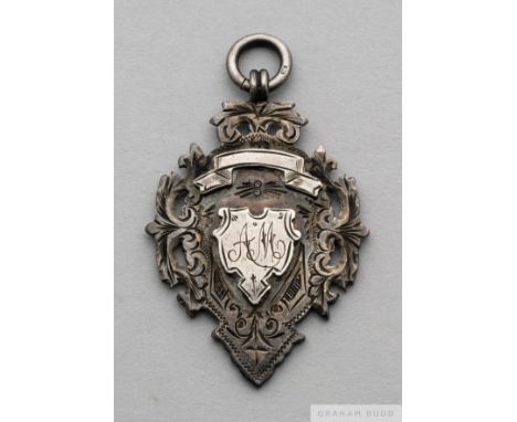 A Victorian silver football medal, 1898-99, 
the obverse inscribed with initials AM, the reverse inscribed T.C.F.C, won by Ea