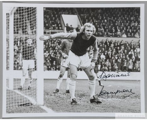 Bobby Moore superb signed b&amp;w photograph,&nbsp;
signed by Moore in light part of image, Press accreditation Bob Thomas sh