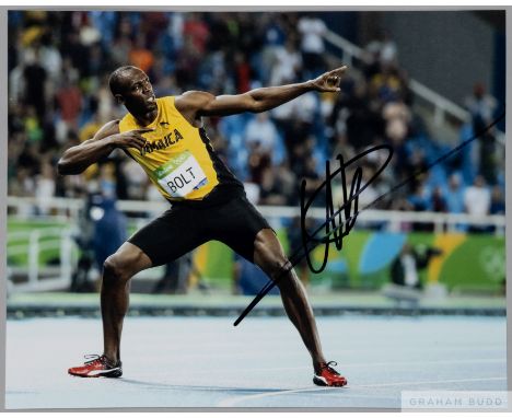 Usain Bolt 2008, 2012 &amp; 2016 100m &amp; 200m Olympic Gold medal winner original signed colour 10 by 8in. photograph,
depi