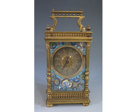 A French Champleve Enamel Mantle Gilt Brass Clock in original fitted travel case and with key, 16.5 cm to handle, winds and r