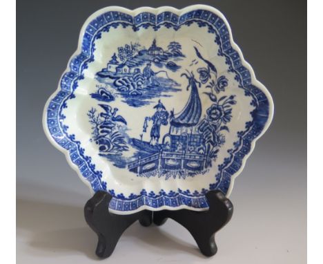 A First Period Worcester Blue and White Teapot Stand decorated with the Fisherman pattern, blue crescent mark, c. 1775. With 