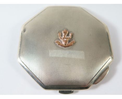 An Elizabeth II Silver Compact with engine turned decoration and bearing the moto 'Cuidich 'n Righ' of the 4th Battalion High