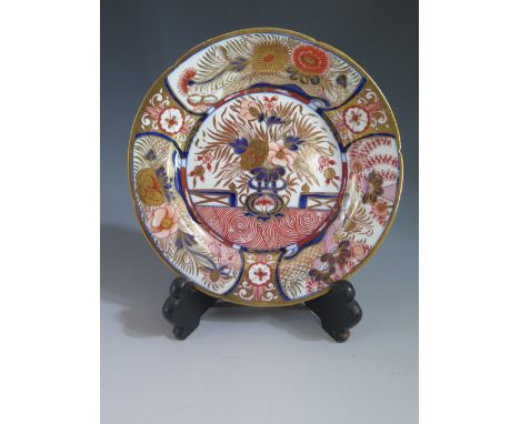 An Eighteenth Century English Hard Paste Porcelain Saucer Dish with relief moulded foliate and enamel floral decoration 18 cm