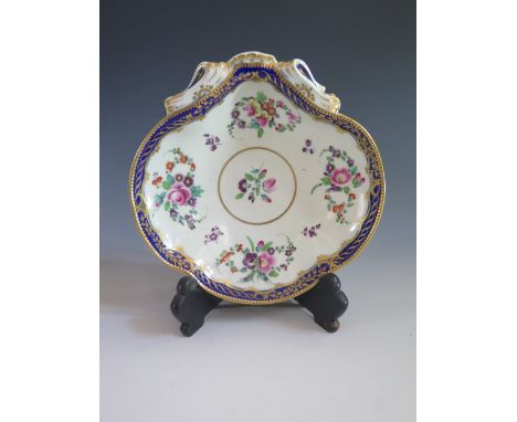 A First Period Worcester Scallop Shaped Dish decorated with enamel sprays and blue border with gilt highlights, c. 1765, blue