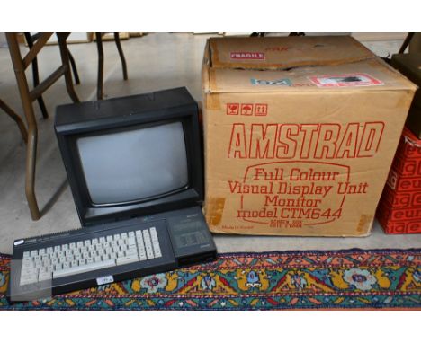 An Amstrad 128K Colour Personal Computer, to/w an Amstrad CTM644 monitor (boxed), a Eumig Mini 5 Makro Zoom 5 cine camera, Eu
