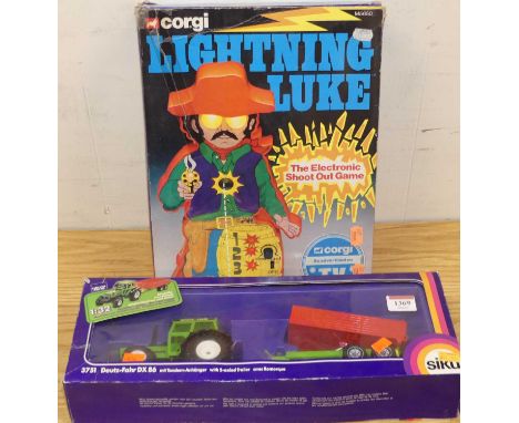 A Corgi Toys No.M5650 Lightning Luke electronic shoot-out game; together with a Siku No.3751 Deutz-Fahr DX86 tractor and trai