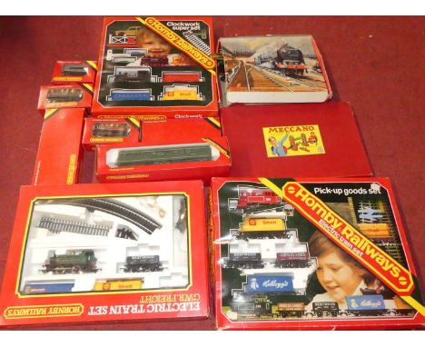 One box of mixed 00 gauge railways to include Hornby and a box of Meccano 1950s gift set specific contents to include a Chad 