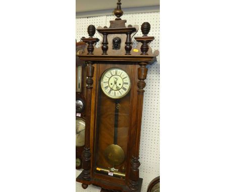 A late 19th century Vienna walnut regulator clock, with enamel dial, eight day movement, two weights, pendulum and winding ke