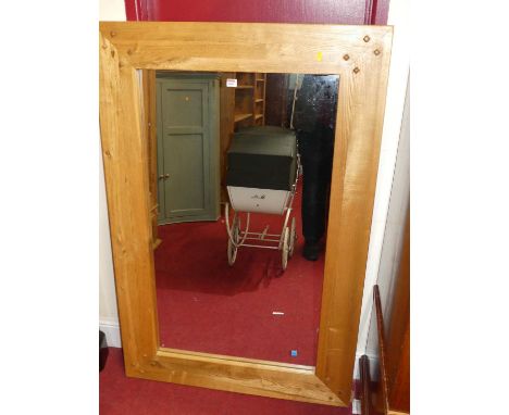 A contemporary joined light oak framed rectangular wall mirror, 139 x 91cm