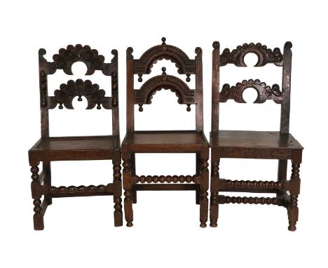 Three Late 17th Century Joined Oak Derbyshire Double-Crescent Backstools, comprising: a carved example with applied mounts ab
