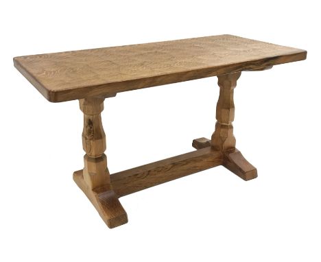 'Mouseman' oak coffee table, rectangular adzed top, two octagonal pillar supports on sledge feet connected by floor stretcher