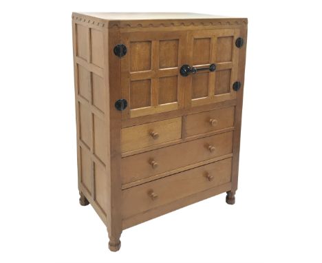 'Mouseman' panelled oak tallboy, panels and frame adzed, double cupboard above two short and two long drawers, by Robert Thom