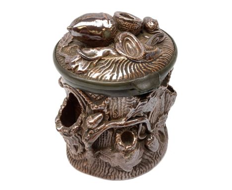 19th century salt glazed tobacco jar, of cylindrical form modelled as a tree trunk, decorated in relief with applied oak leav