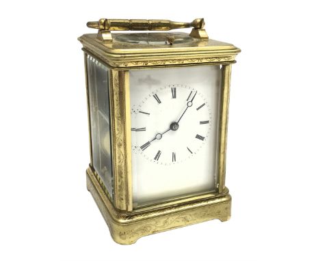 Early 20th century brass five glass carriage clock with button repeater, the brass case engraved with trailing foliage decora