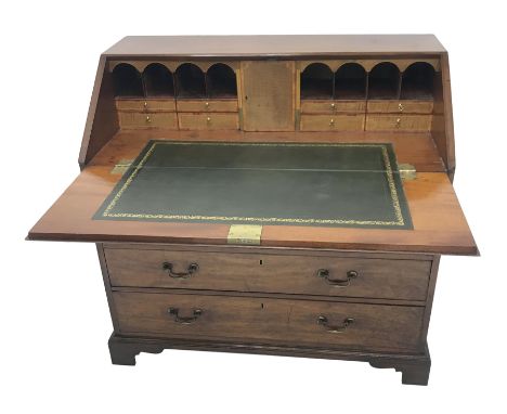  George lll mahogany bureau with crossbanded fall front, the interior with cupboard, drawers and compartments above four long