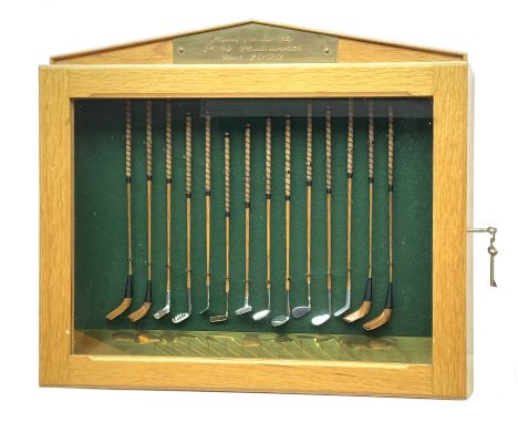 Modern handcrafted miniature set of fourteen 19th century style golf clubs by P.D. Rushworth dated 2000, each with turned woo