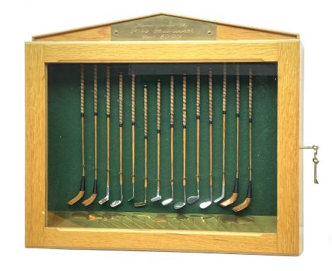 Modern handcrafted miniature set of fourteen 19th century style golf clubs by P.D. Rushworth dated 2000, each with turned woo