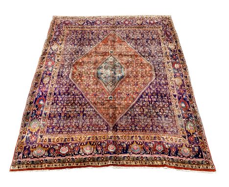 Fine Persian Bijar rug carpet, red ground lozenge with inner central lozenge on dark blue field, profusely decorated with her