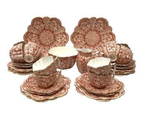 Wileman &amp; Co (Foley) Snowdrop pattern tea service c1899, comprising twelve trios, two cake plates, jug and slop bowl, pat