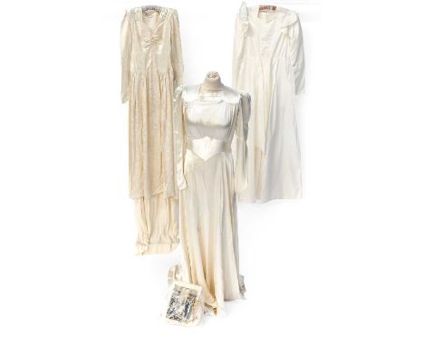 Three Circa 1930-40s Wedding Dresses comprising a cream liquid satin long sleeved dress with square neckline and stitched det