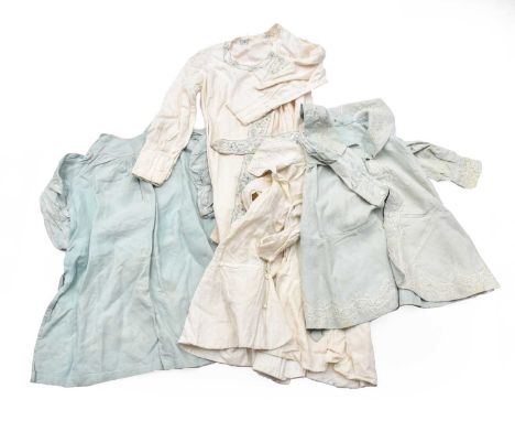 Three Edwardian Children's Linen Coats, comprising a boy's cream linen long sleeved example with lace mount to the wide colla