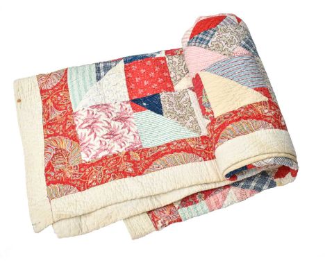 Mid 19th Century Patchwork Quilt, incorporating printed cotton textiles including stripes, checks, floral sprigs, turkey red 
