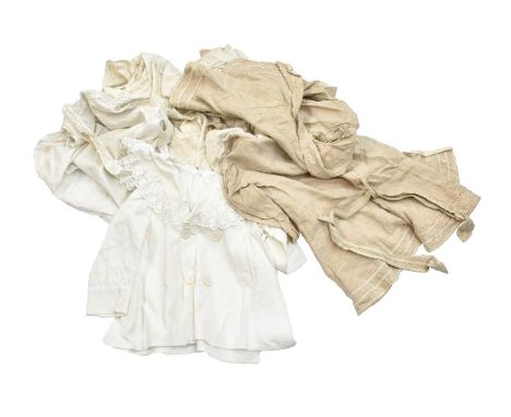 Five Edwardian Boys Linen Coats, comprising a dark cream linen long sleeved example with white ric rac trim to the wide colla