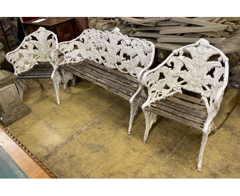 A Victorian style fern pattern painted cast metal garden bench and two chairs, length 151cm, depth 55cm, height 90cm