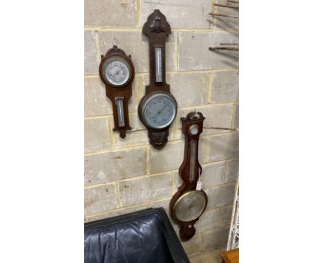 An early 19th century mahogany wheel barometer, height 112cm together with two later oak aneroid barometers
