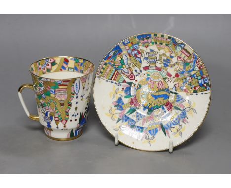 A Russian gilt enamel porcelain tea cup and saucer, cup 8cms high