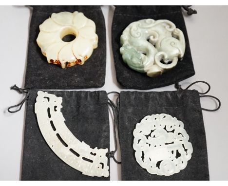 Three Chinese jade celadon roundels/pendants and a huang plaque, carved dragon roundel 5.5 cms diameter (4)