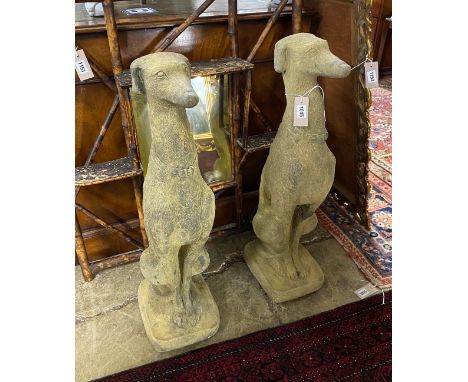 A pair of reconstituted stone seated greyhound garden ornaments, height 74cm