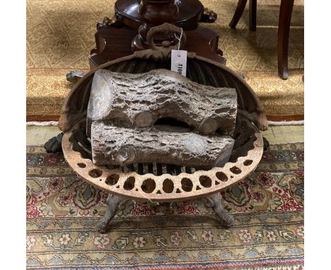 A Victorian cast iron fire grate, width 44cms and a plaster faux log stack.