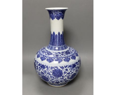 A Chinese blue and white bottle vase, Qianlong seal mark, 37cms high