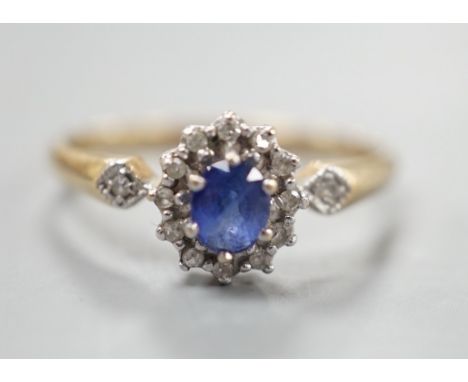 A modern 9ct gold, sapphire and diamond set cluster ring, size R, gross 2.3 grams.