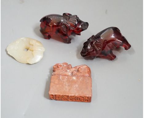 A Chinese Jade bi disc, two cherry amber ox and a soapstone seal