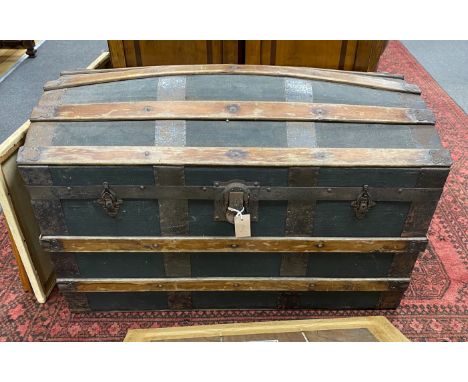 An early 20th century dome top travelling trunk, width 92cm, height 56cm
