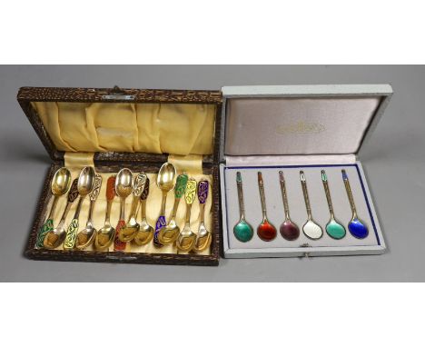 A set of of twelve Danish sterling and polychrome enamel coffee spoons, by W &amp; S Sorenson, 94mm and a similar cased set o