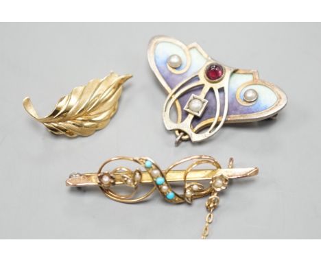 A continental Art Nouveau 900 gilt white metal, cabochon stone, seed pearl and enamel set brooch, 36mm and two 9ct brooches i