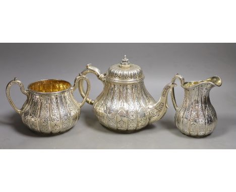 A Victorian engraved silver three piece tea set, of pear shape, by John Samuel Hunt (Hunt &amp; Roskell late Storr &amp; Mort