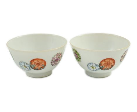 A pair of Chinese enamelled porcelain tea bowls, Qianlong seal marks,  7cms diameter