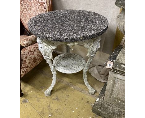 A Victorian cast iron circular garden table with weathered stone top, diameter 61cm, height 72cm