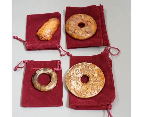 Four Chinese archaistic jade carvings - three bi discs and a cicada, largest 7cms