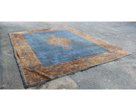 An antique Ushak carpet, with central medallion on a pale blue ground, within conforming border, approx 3m x 2m With even wea