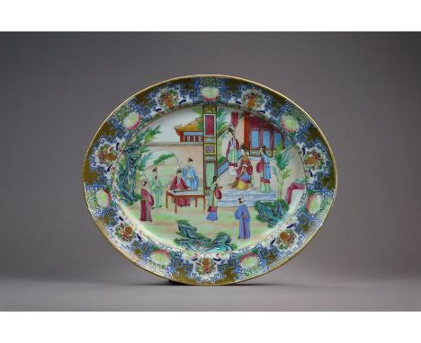 A Chinese Canton Famille rose porcelain oval platter 19th Century Finely painted to the well with a scene of ladies and gentl