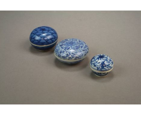 Three small Chinese seal paste pots and covers 18th/19th Century The first decorated with lotus flowers amid dense foliage, 5