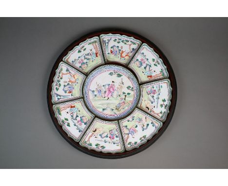 A Chinese cased enamel luncheon set Late Qing Dynasty In nine parts with central circular dish surrounded by eight shaped dis