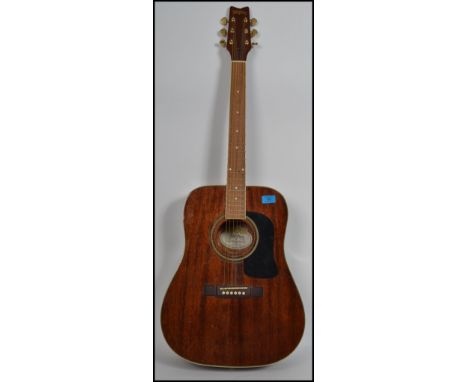A vintage 20th century Washburn six string acoustic guitar model Dloom/TBR with inset mother of pearl fret markers.