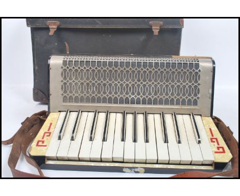 Musical Instruments. A cased vintage 20th century German made Pietro piano accordion in its original case.  